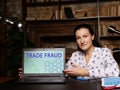 Business concept about TRADE FRAUD with sign on the laptop. the criminal offence of carrying on ofbusiness by a company for aÃÂ 